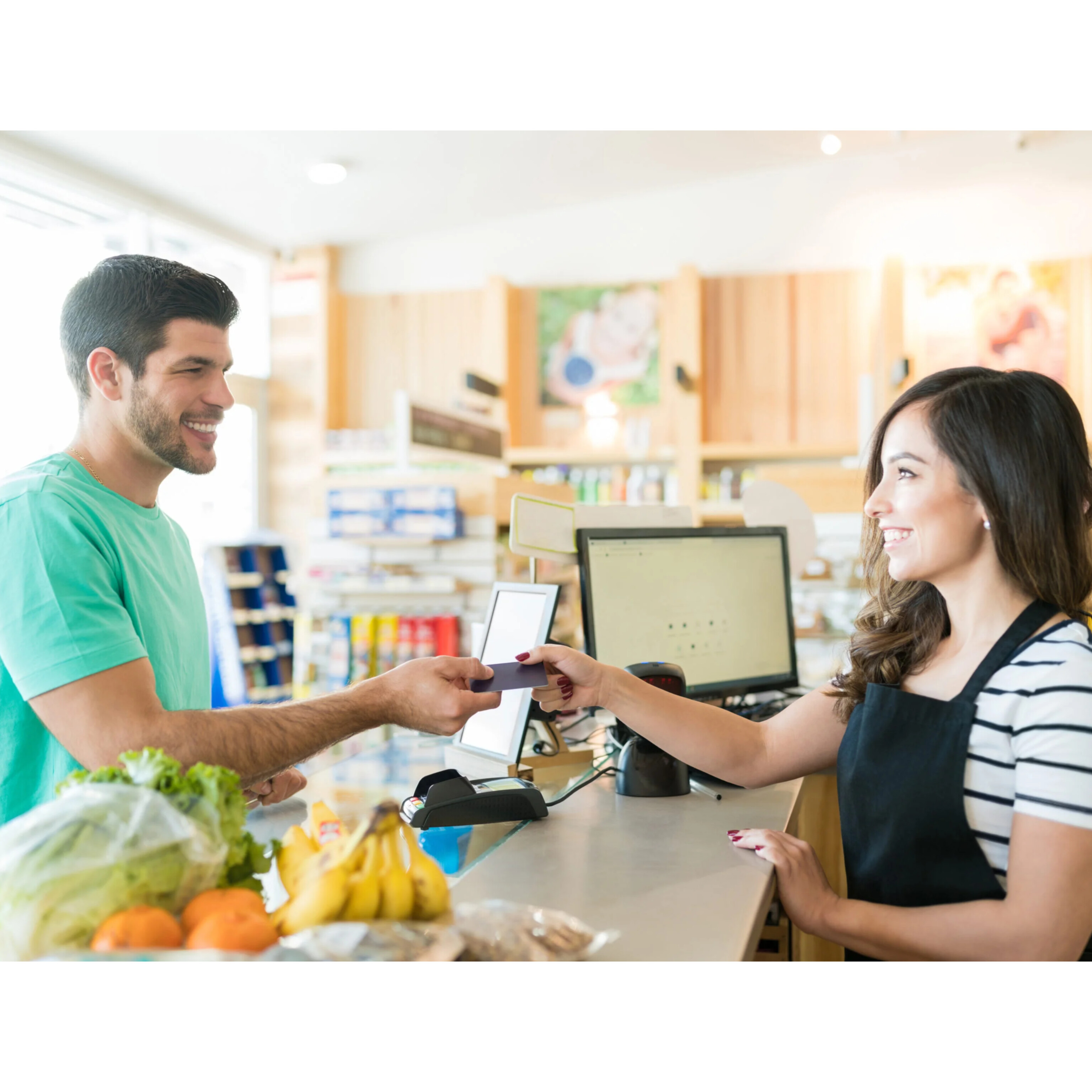 Retailer engaging with a customer at a store counter